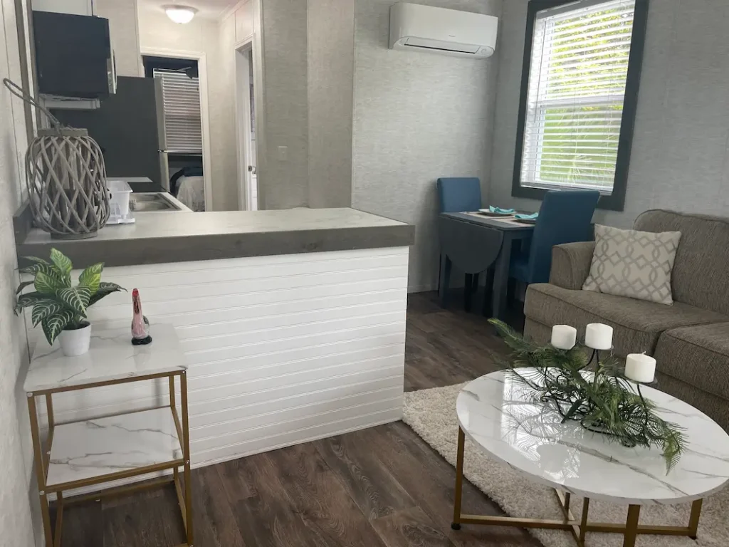 perfectly decorated park model with sofa, dining table, seperated kitchen area etc.,